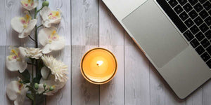 Candles can separate relaxing spaces from computer workspaces.