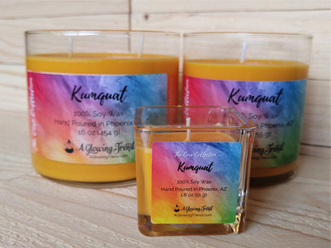 Selection of yellow-orange Kumquat scented soy candles by A Glowing Trend.