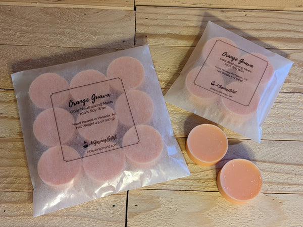 Selection of light orange odor neutralizing Orange Guava fragranced wax tart melts.