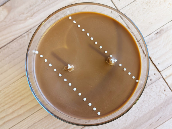 Close-up of brown Gingerbread scented soy candle by A Glowing Trend showing white wax drops.