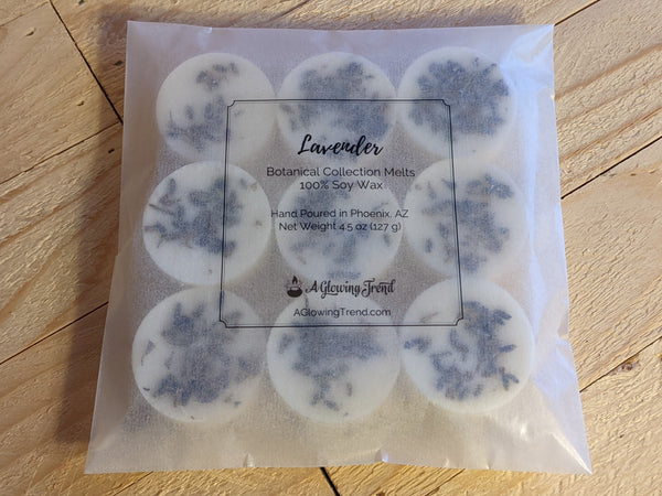 9-pack of white Lavender fragranced wax tart melts with lavender buds in the wax.