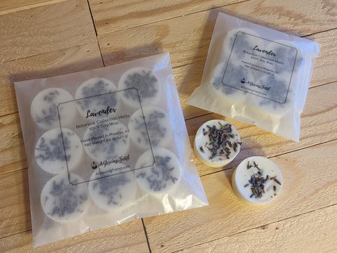 Selection of white Lavender fragranced wax tart melts with lavender buds in the wax.
