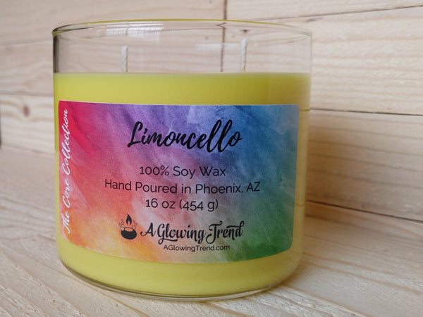 A 16 oz glass tumbler containing a yellow Limoncello scented soy candle by A Glowing Trend