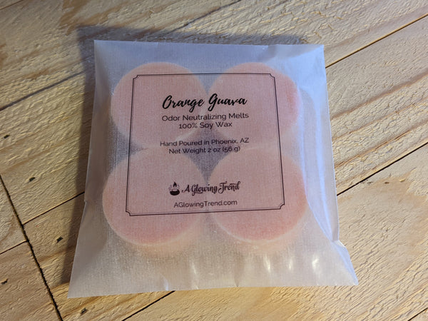 4-pack of light orange odor neutralizing Orange Guava fragranced wax tart melts.