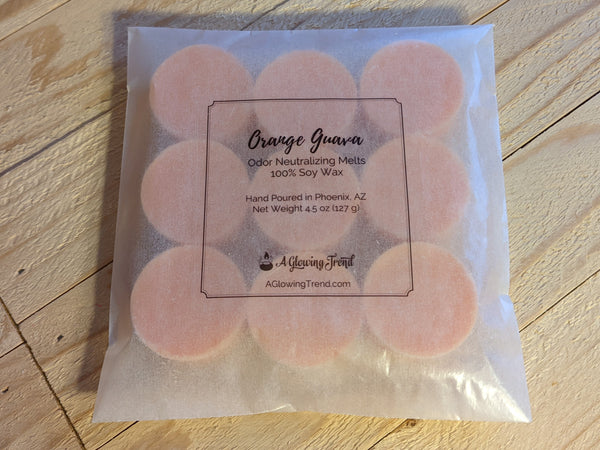 9-pack of light orange odor neutralizing Orange Guava fragranced wax tart melts.