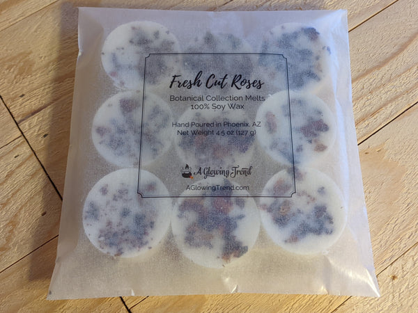 9-pack of white Fresh Cut Roses fragranced wax tart melts with rose petals in the wax.