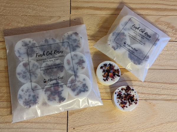 Selection of white Fresh Cut Roses fragranced wax tart melts with rose petals in the wax..