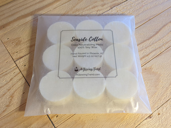 9-pack of white odor neutralizing Seaside Cotton fragranced wax tart melts.
